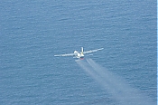 Oil Spill Contractor C-130 Dispersant Spray Aircraft - Picture high definition stock photo - Oil Spill Contractor C-130 Dispersant Spray Aircraft - Picture
