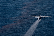 Oil Spill C-130 Dispersant Spray Aircraft - Aerial Stock Photo high definition stock photo - Oil Spill C-130 Dispersant Spray Aircraft - Aerial Stock Photo