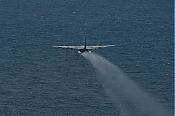 C-130 Oil Dispersant Spray Aircraft In Flight - Stock Photo high definition stock photo - C-130 Oil Dispersant Spray Aircraft In Flight - Stock Photo