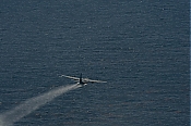 C-130 Spray Aircraft Flying Over BP Spill - Stock Photo high definition stock photo - C-130 Spray Aircraft Flying Over BP Spill - Stock Photo