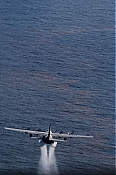 Aerial View of BP Oil Spill C-130 Dispersant Spraying Aircraft high definition stock photo - Aerial View of BP Oil Spill C-130 Dispersant Spraying Aircraft